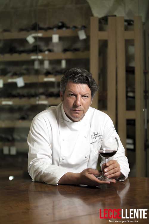 Chef Giancarlo Polito in the well-stocked cellar of his exclusive restaurant in Montone, Umbria Italy